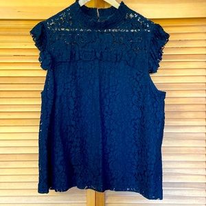 Lace sleeveless blouse.